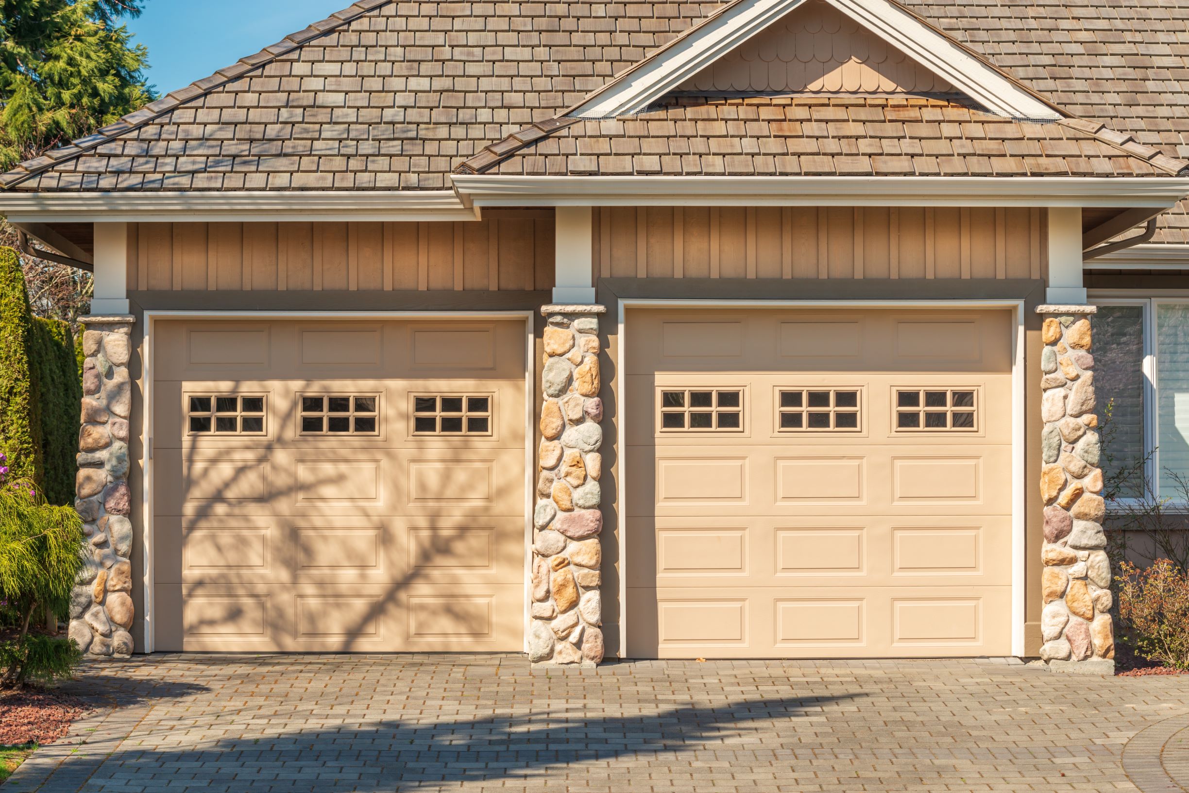 fragment of a luxury house with a garage door in v 2026 03 26 11 19 00 utc1 Overhead Door Replacement Sterling Heights MI