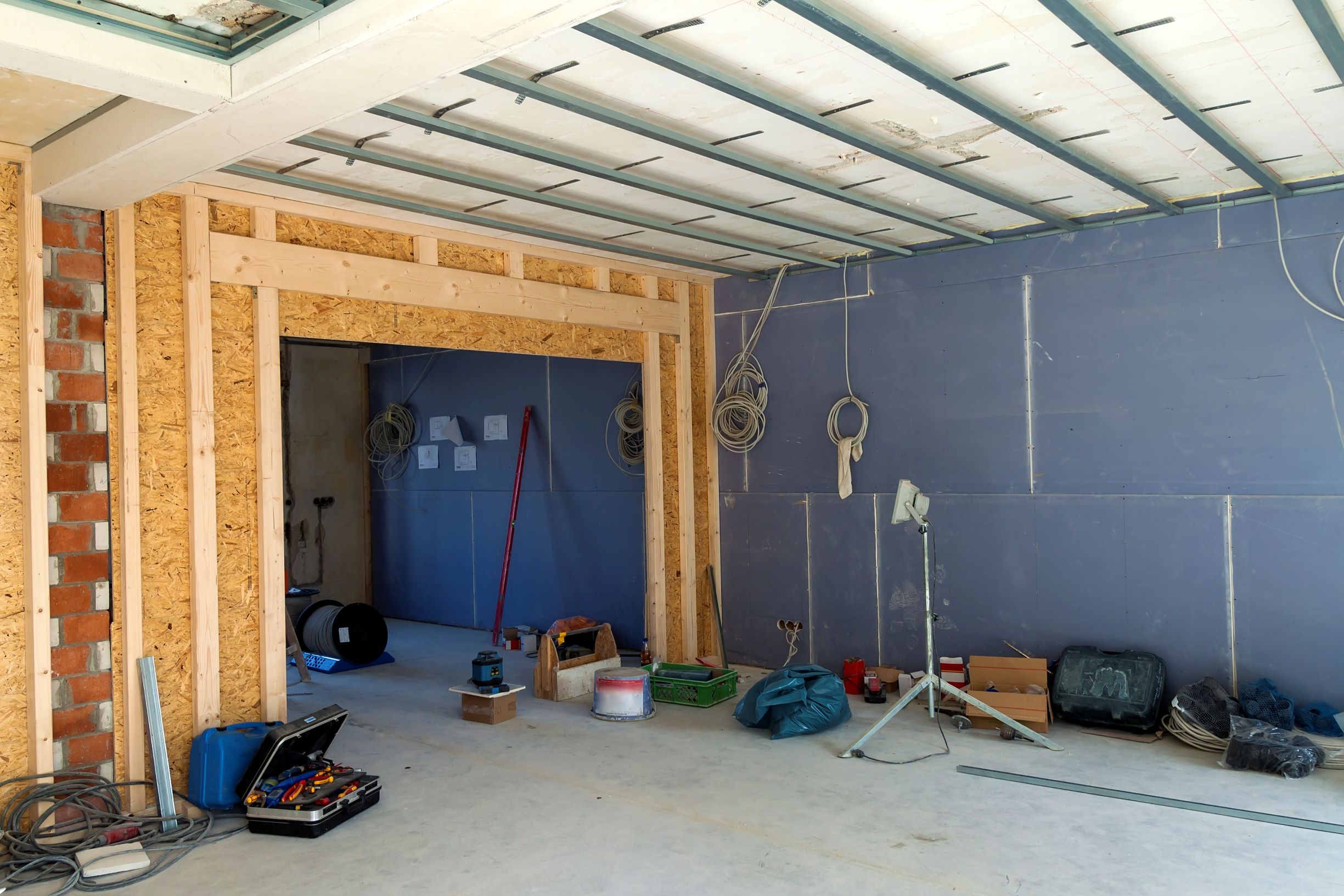 indoor construction site with tools and building m 2026 03 17 00 41 55 utc1 Overhead Door Installations Sterling Heights MI